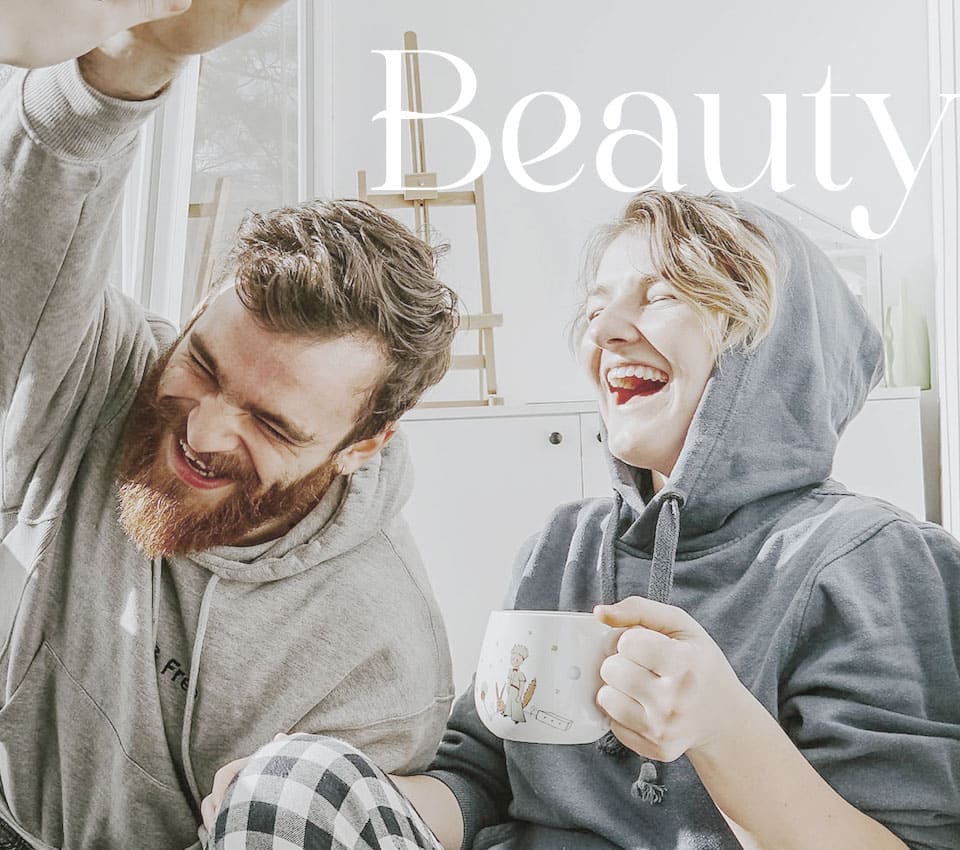 beauty lifestyle couple laughing indoors
